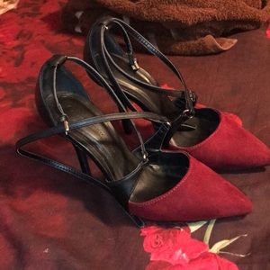 Burgundy and black high heels.